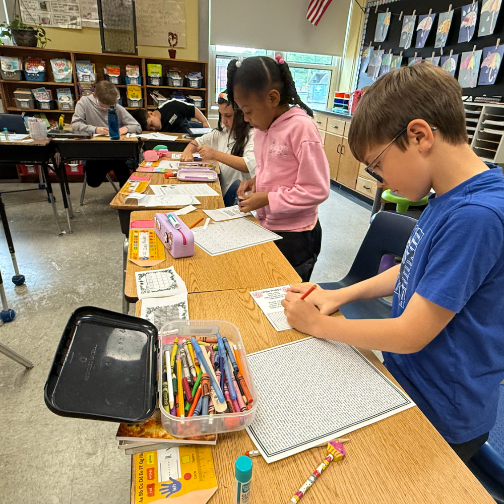 students coloring on a paper