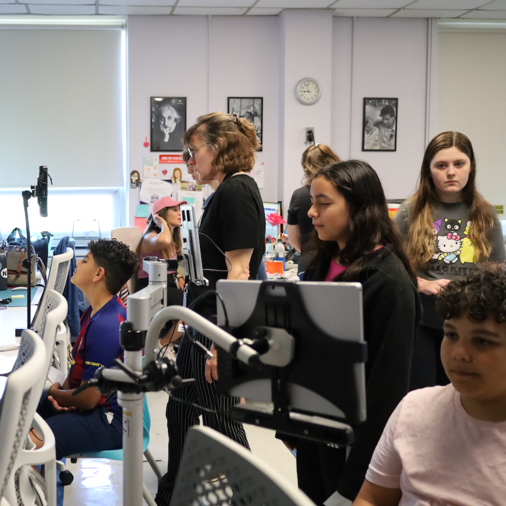 students staring at tablet