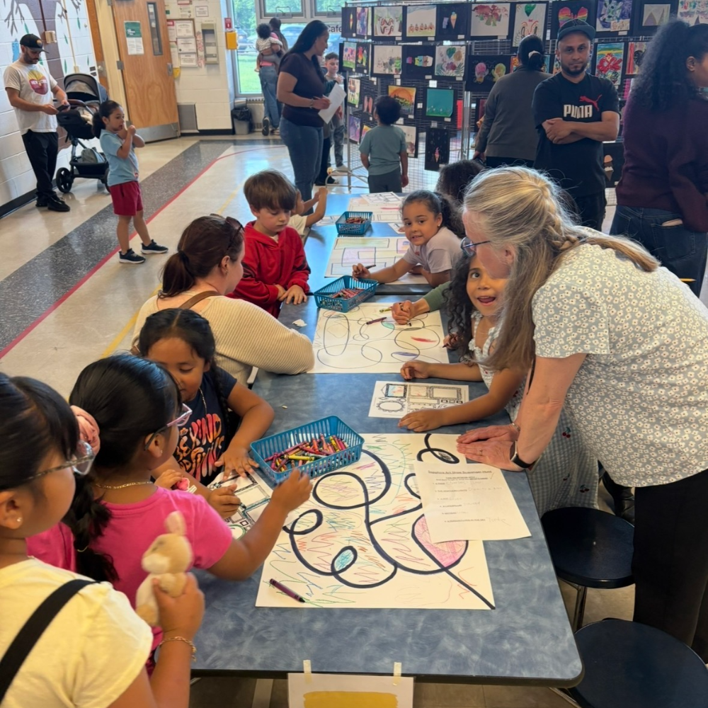 students coloring at art show