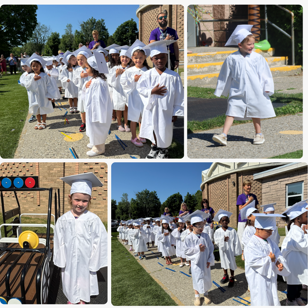 students wearing white caps and gowns and standing next to toy car