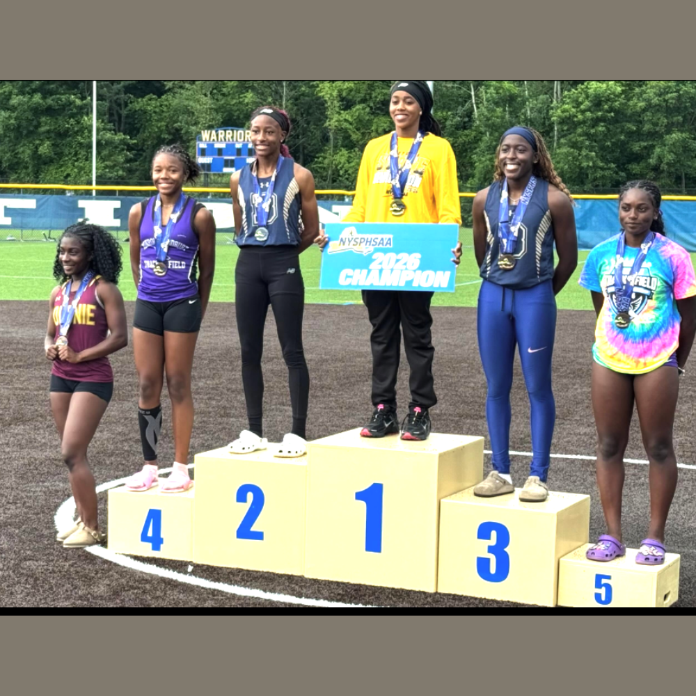 students standing on a numbered podium