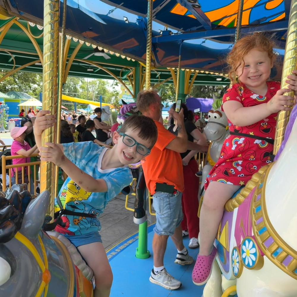 two students on a carosel