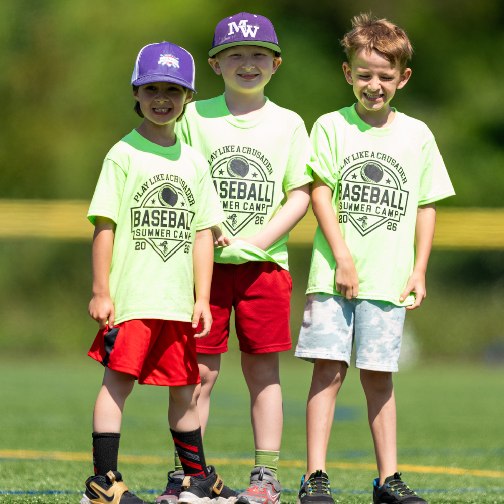 three students standing wearing baseball caps 