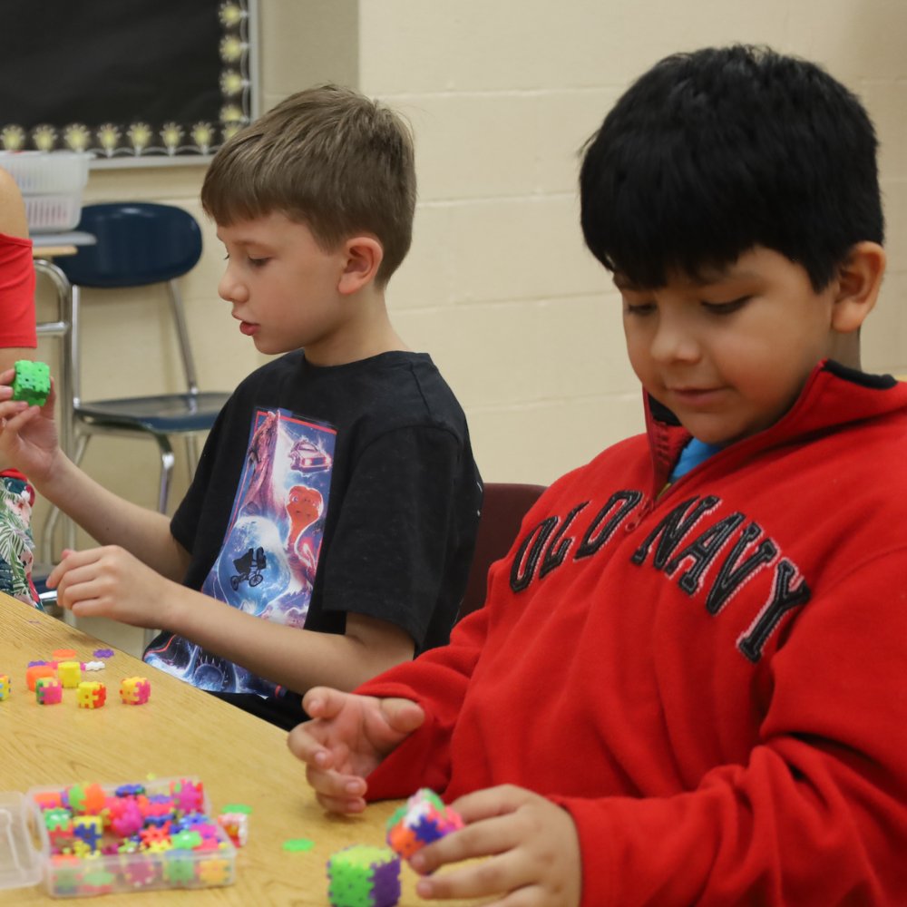 old navy, two students putting blocks together