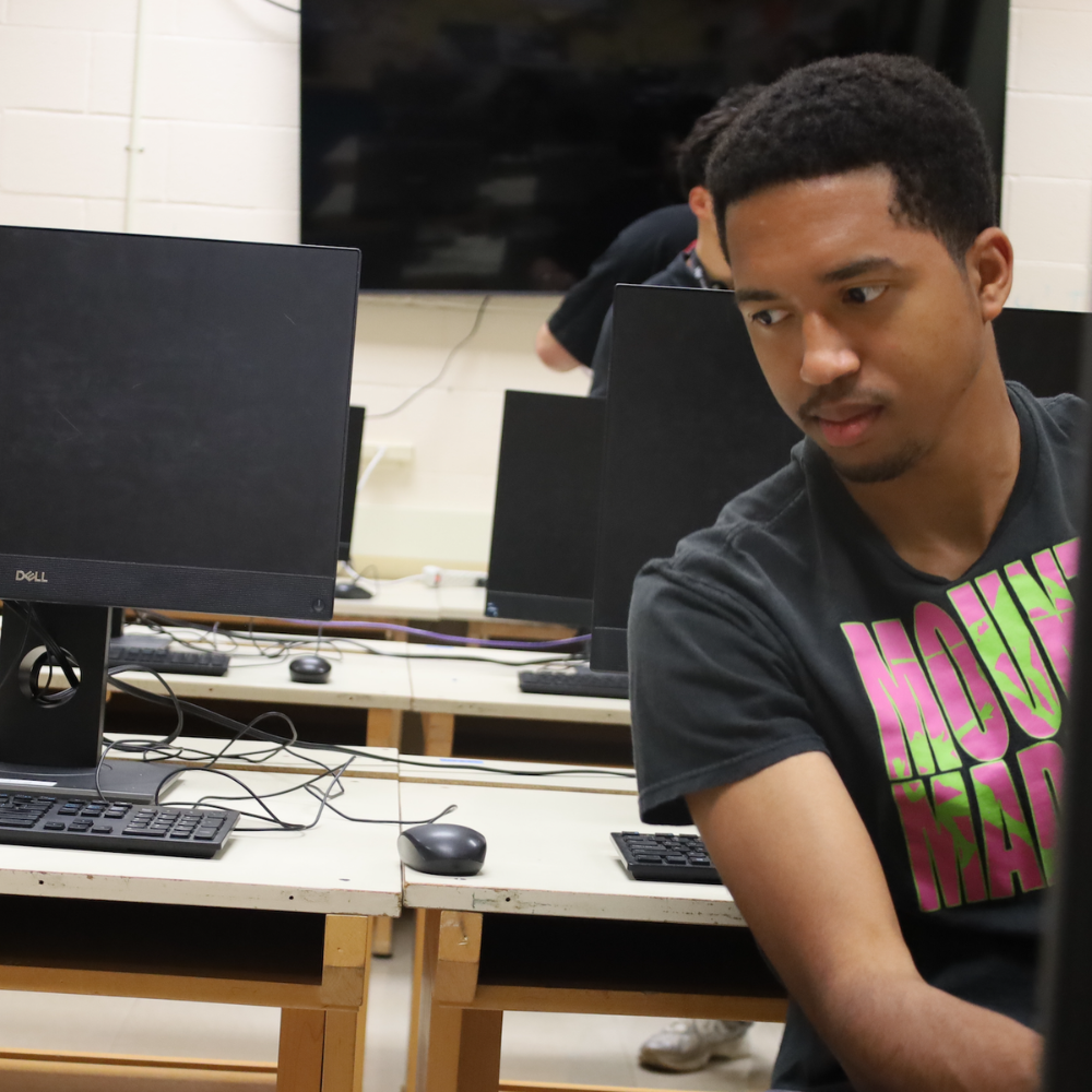 student looking at a computer
