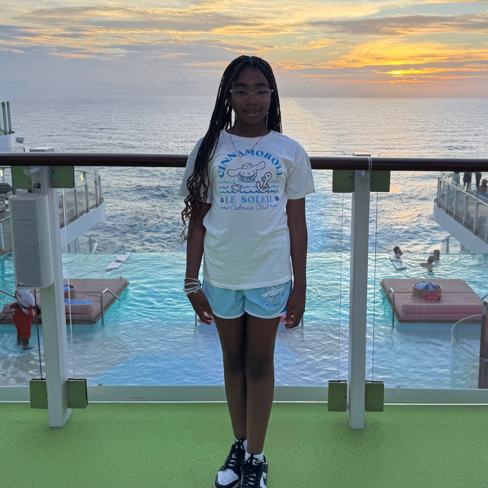 girl standing on green turf on a cruise 