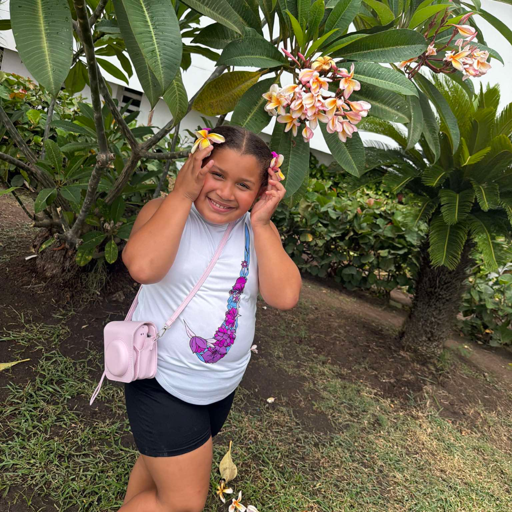 girl standing with flowers in her hair