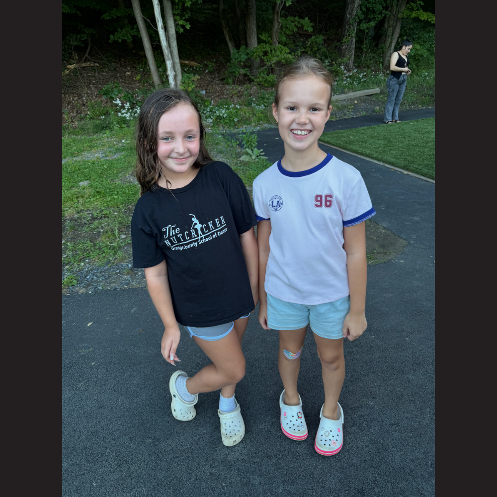two students in white and black shirts 