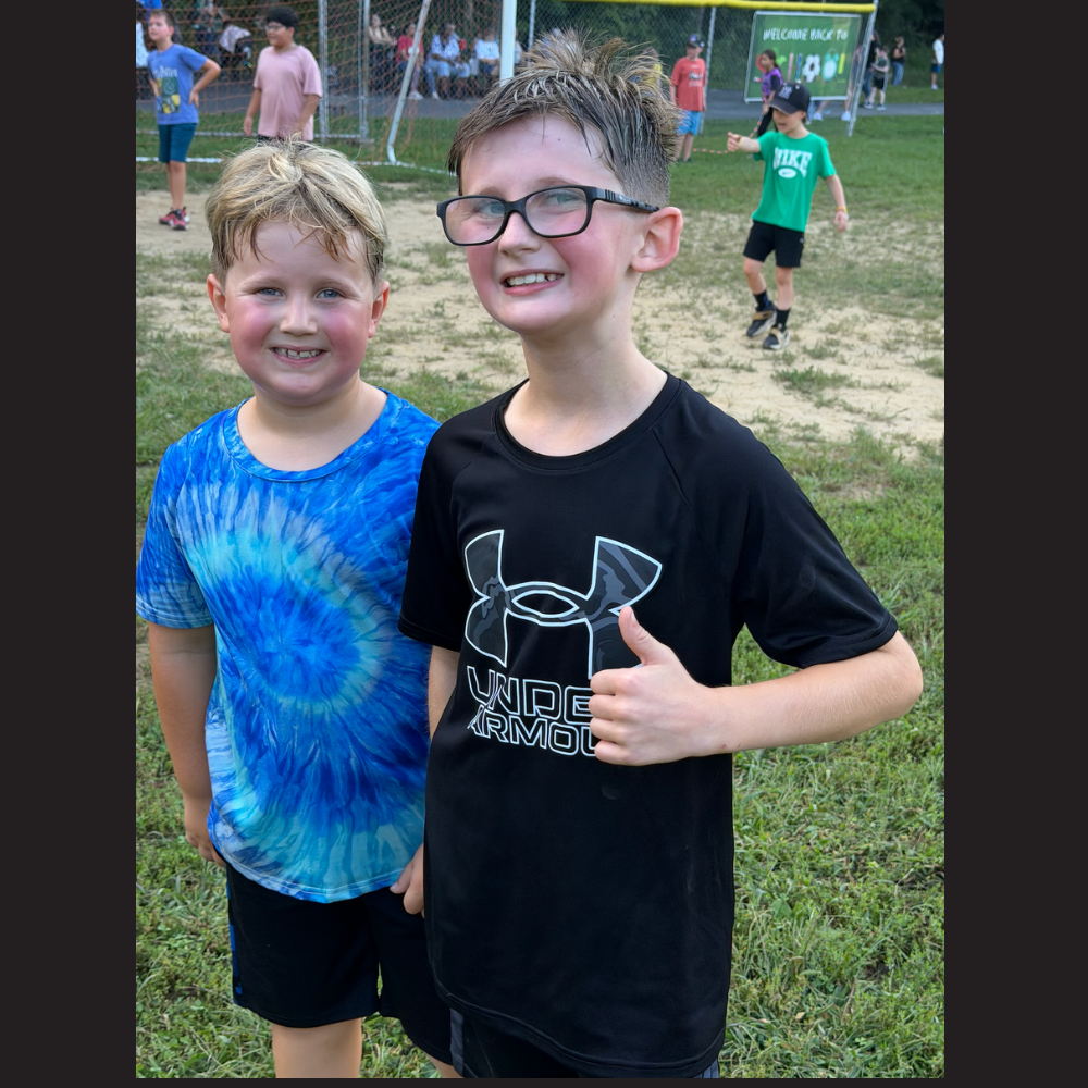 two boys with black and blue shirts