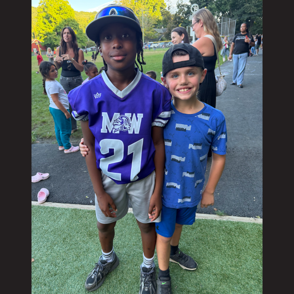 two students with purple and blue jerseys