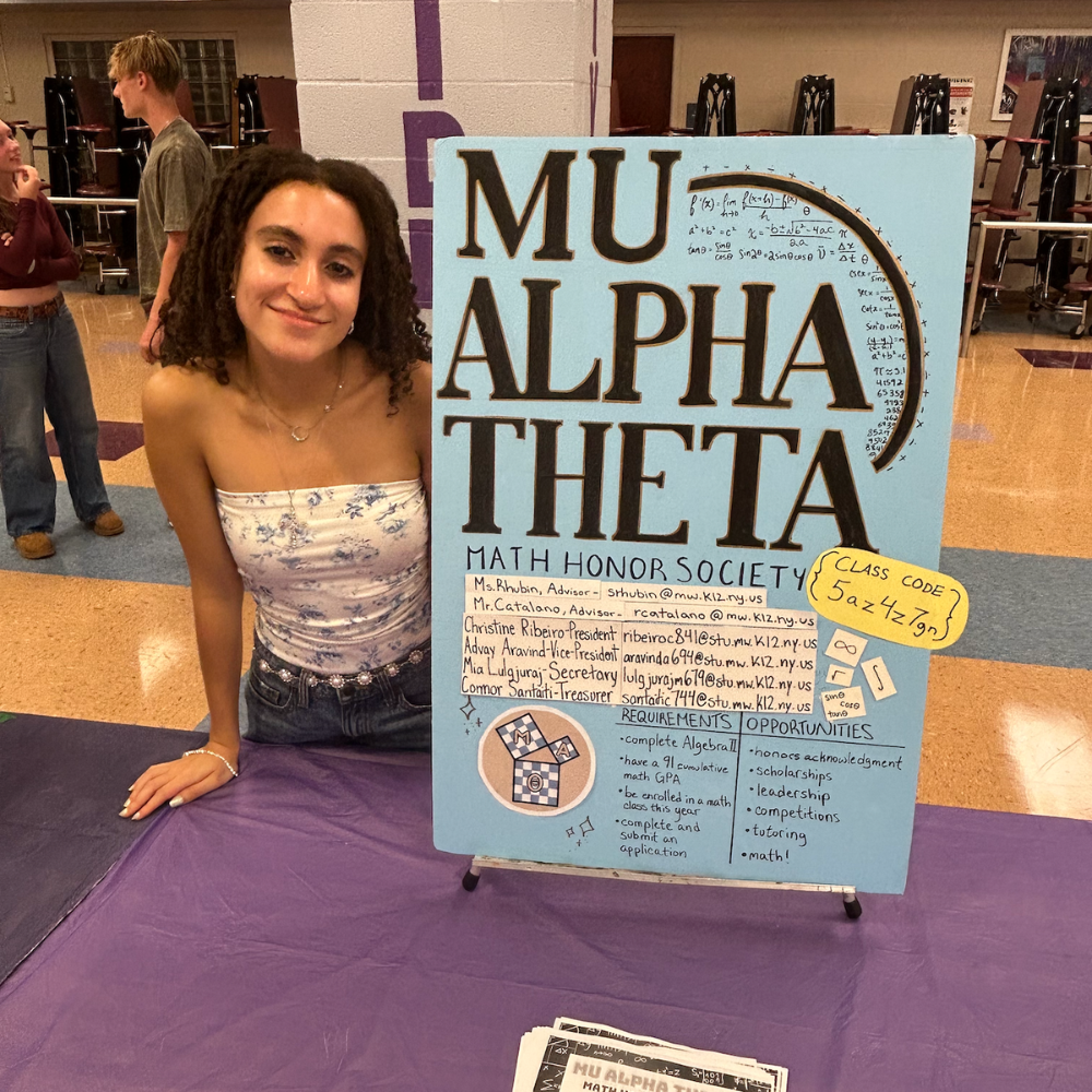 student standing with a poster that says MU ALPHA THETA