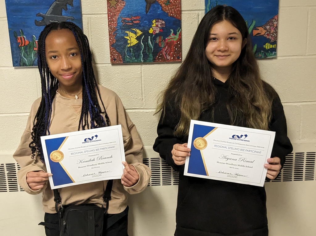 spelling bee contestants with their certificates