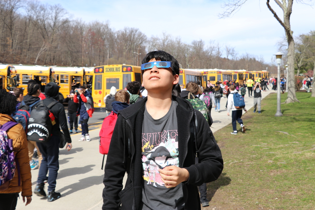 student looking at eclipse