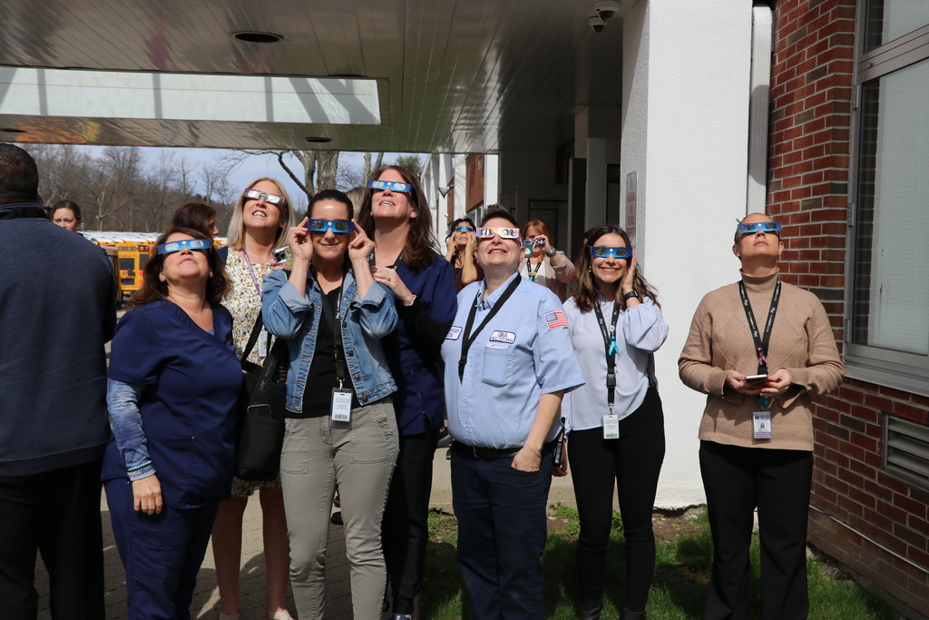 teachers looking at eclipse
