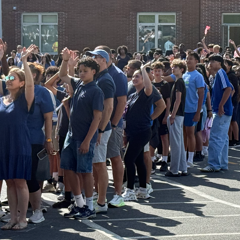 students standing wearing blue