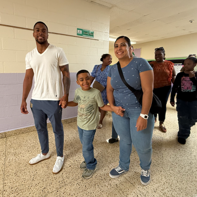 family standing in a hallway