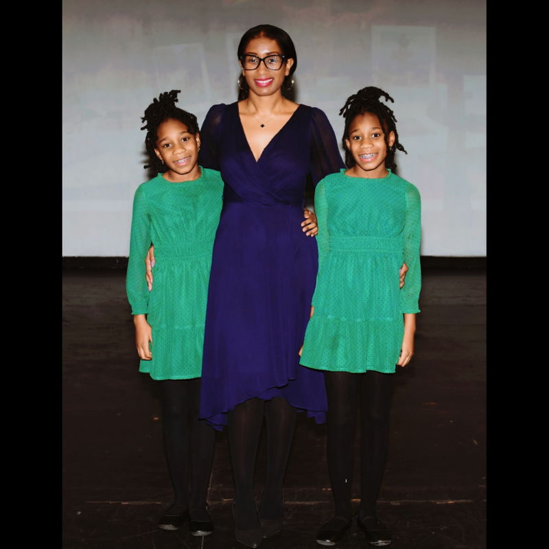 board member with her twin daughters
