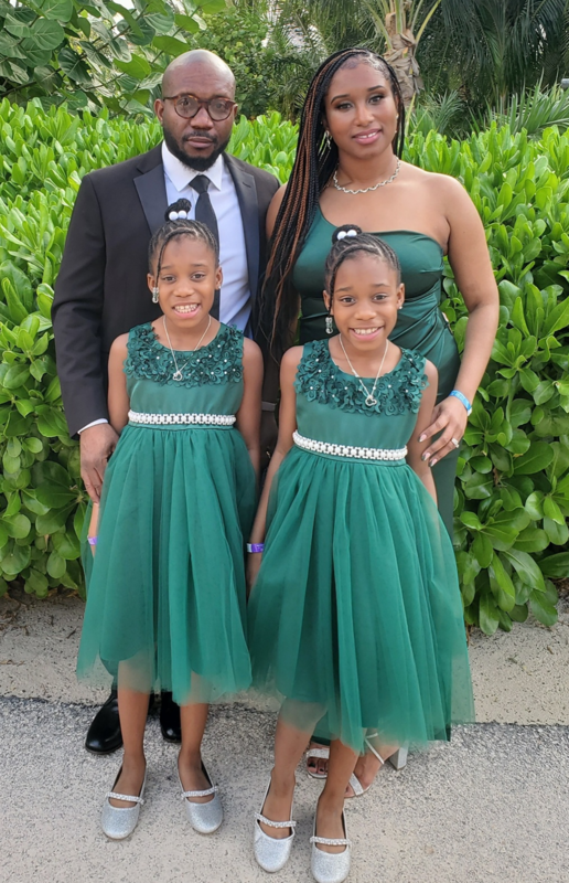 Kaytlin Simmons, board member, with her twin daughters and husband
