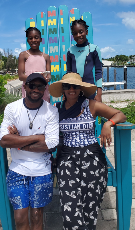 board member Kaytlin Simmons with her husband and twin daughters