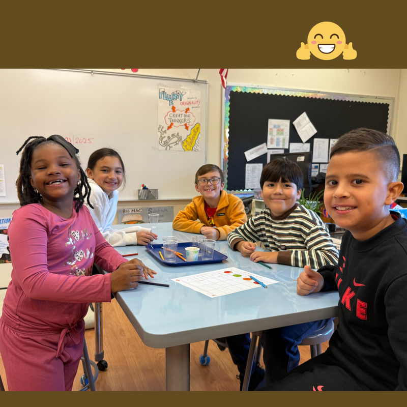 students sitting at a blue table