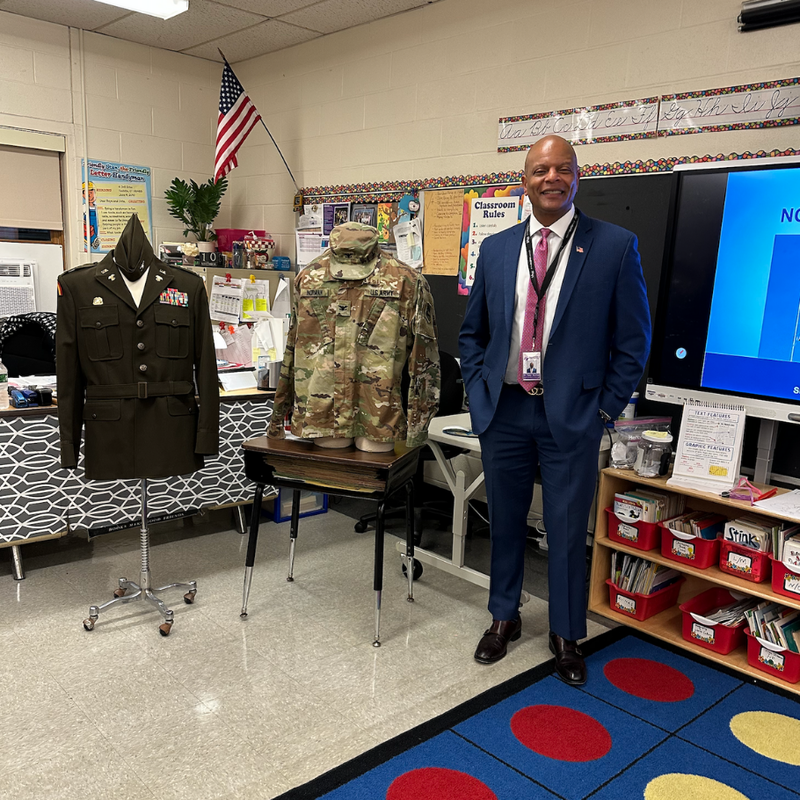 man standing in a blue suit