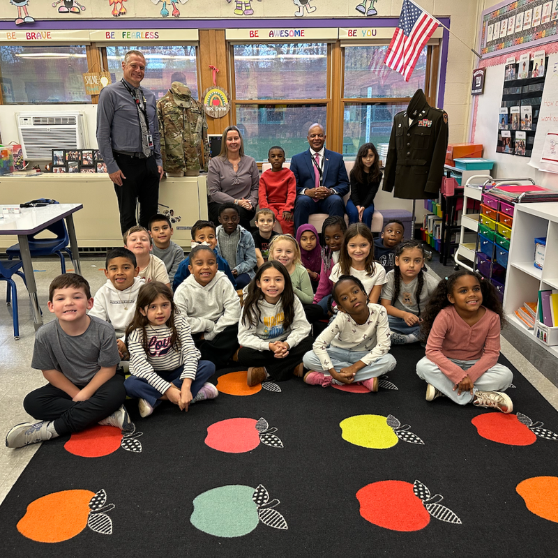 class sitting and smiling