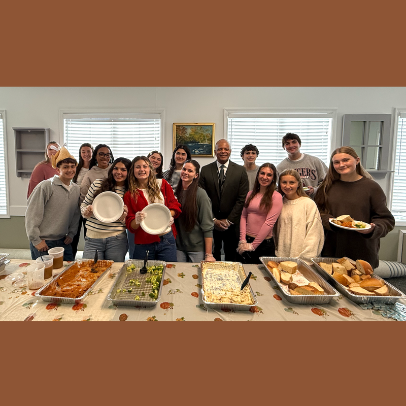 students standing serving food