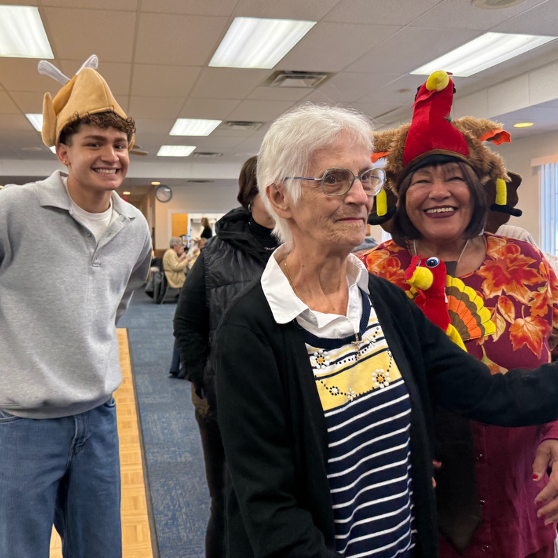 woman and man with plush turkey hats