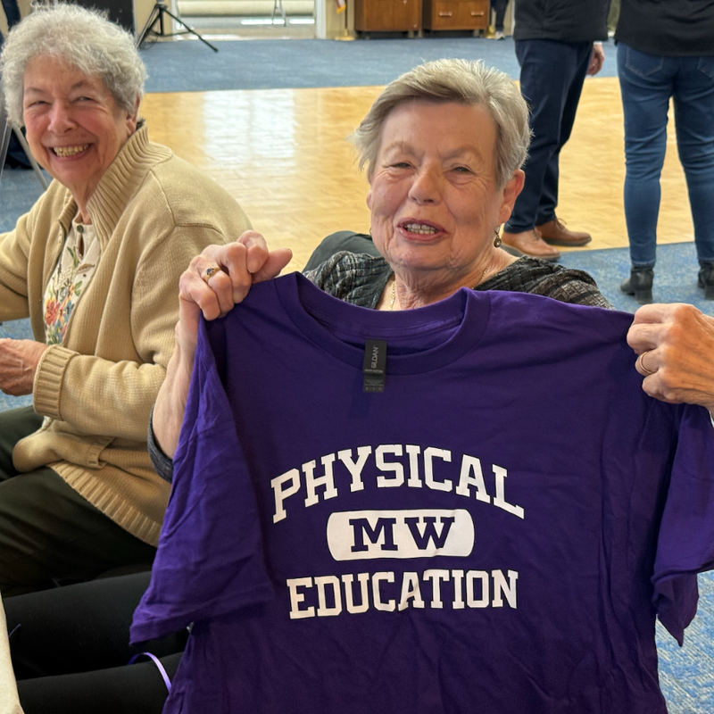 woman with a purple physical education shirt