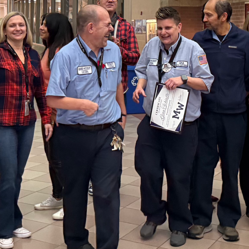 woman and man in blue shirt laughing 