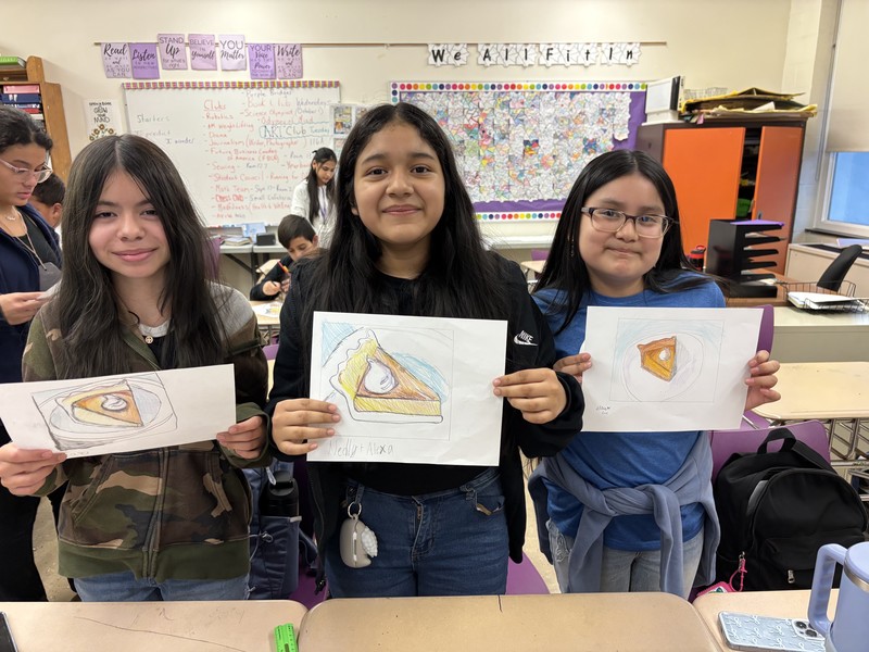 students with their pumpkin pie projects
