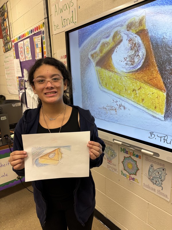 student with her pumpkin pie project