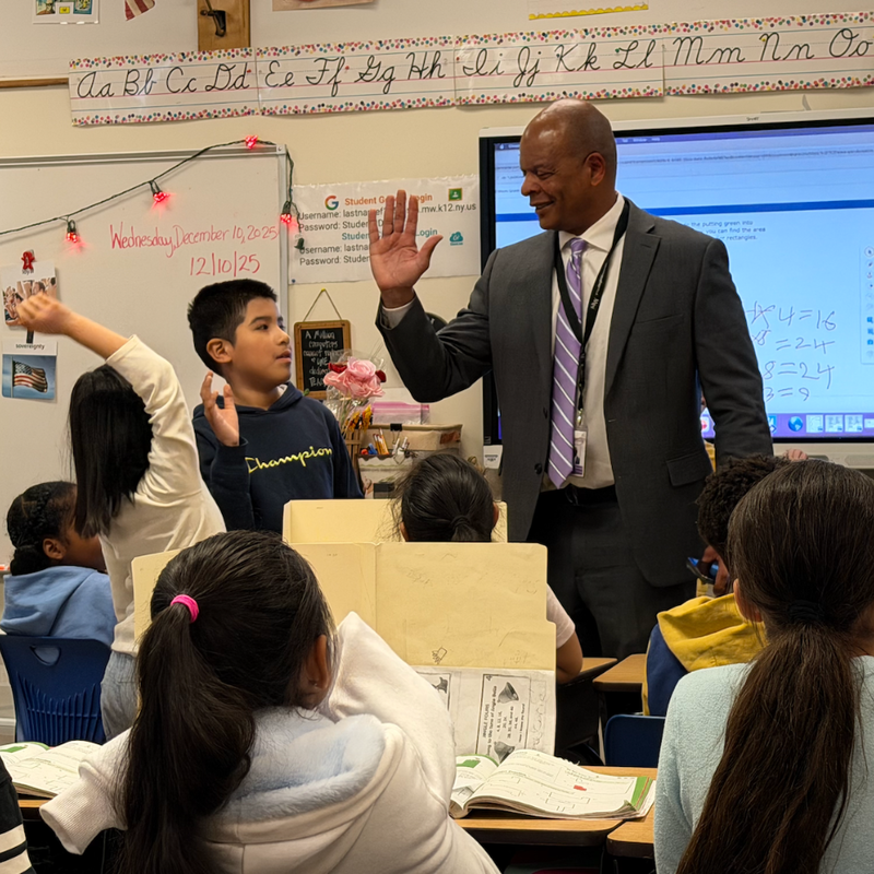 man giving student a high five
