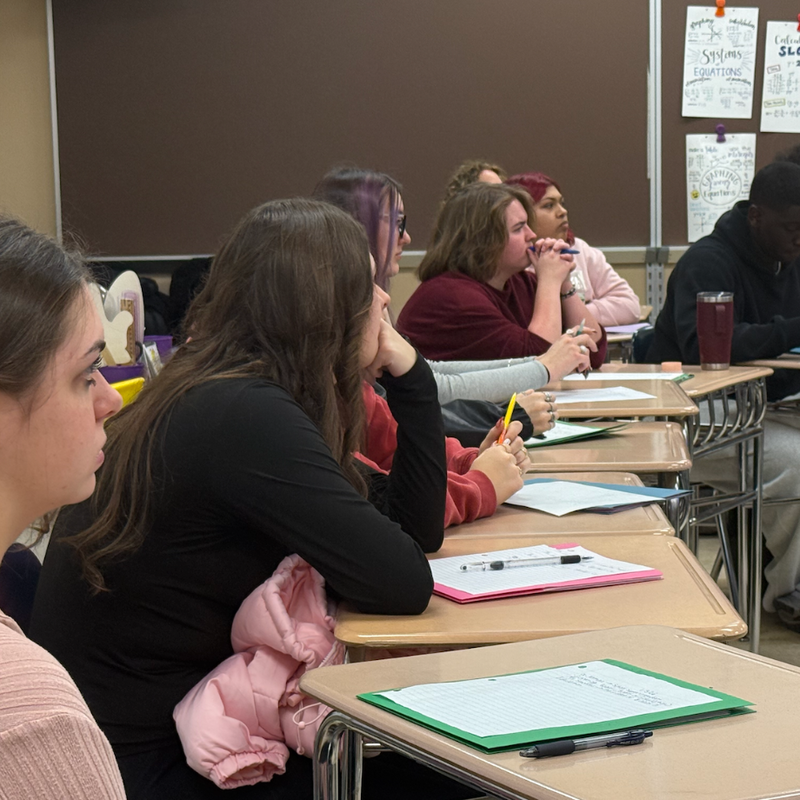 students sitting at desk 