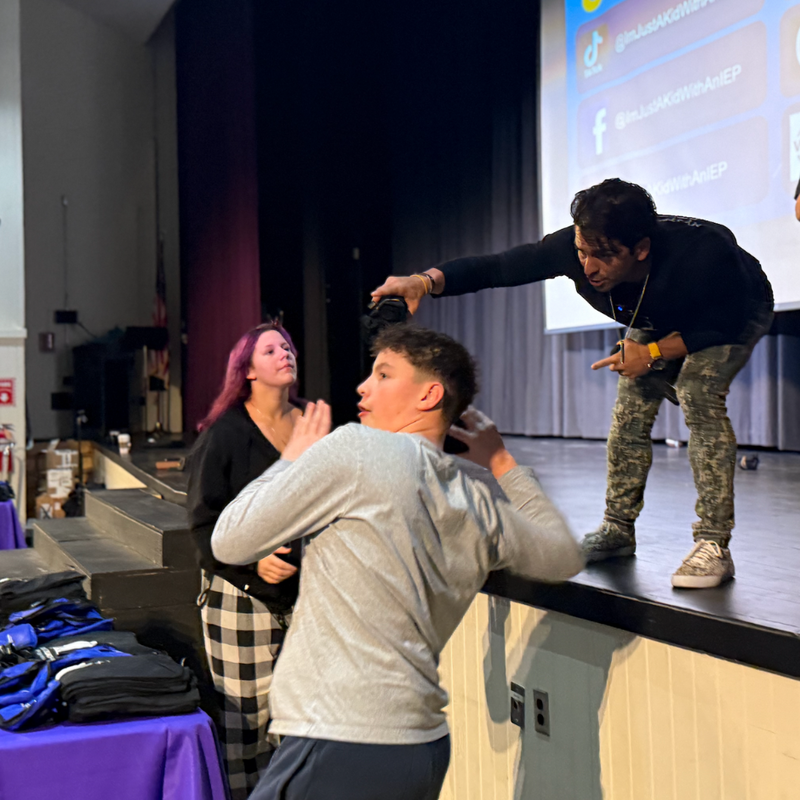 student throwing ball 