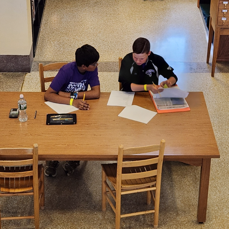 two students sitting at a desk