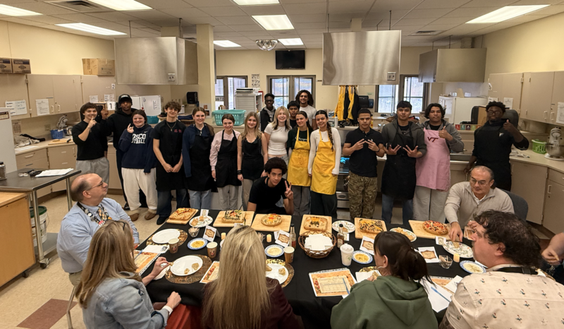 Students standing in kitchen in class