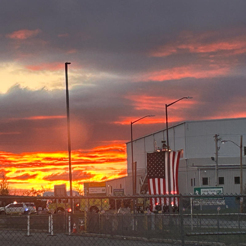 sunrise with American flag in background
