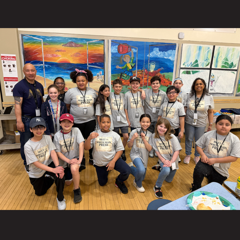 students kneeling and standing 