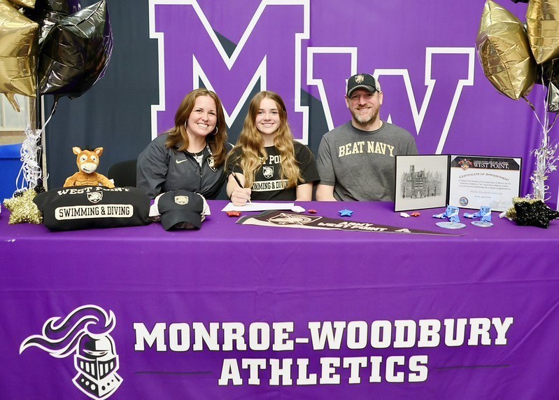  Molly with her parents at signing