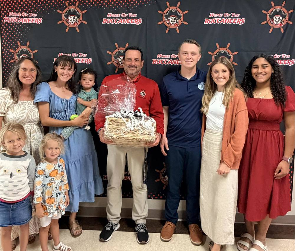 Group donating honey with Principal