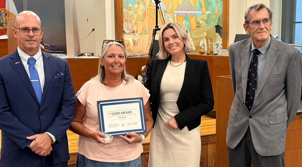 Teacher is recognized with a GEM Award at school board meeting