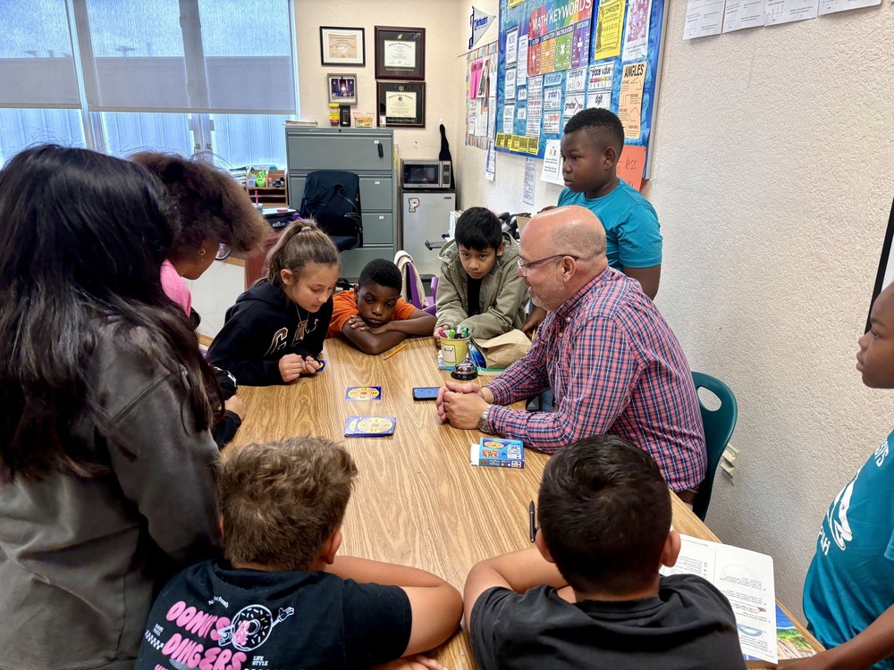 Teacher plays a game to teach math to students