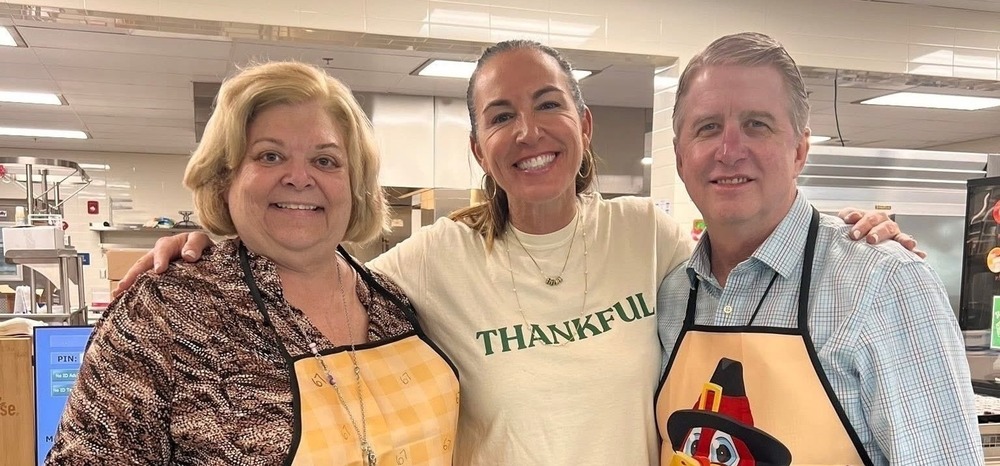 Prinicipal, AP and Pat Lefere serving Thanksgiving lunch