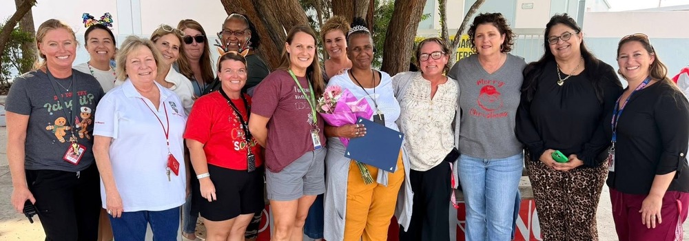 School Related Personnel of the Year Emory Carey with staff of KWHS