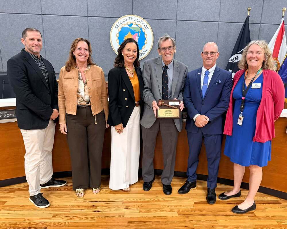 School Board member John Dick retires, pictured with school board members and Superintendent