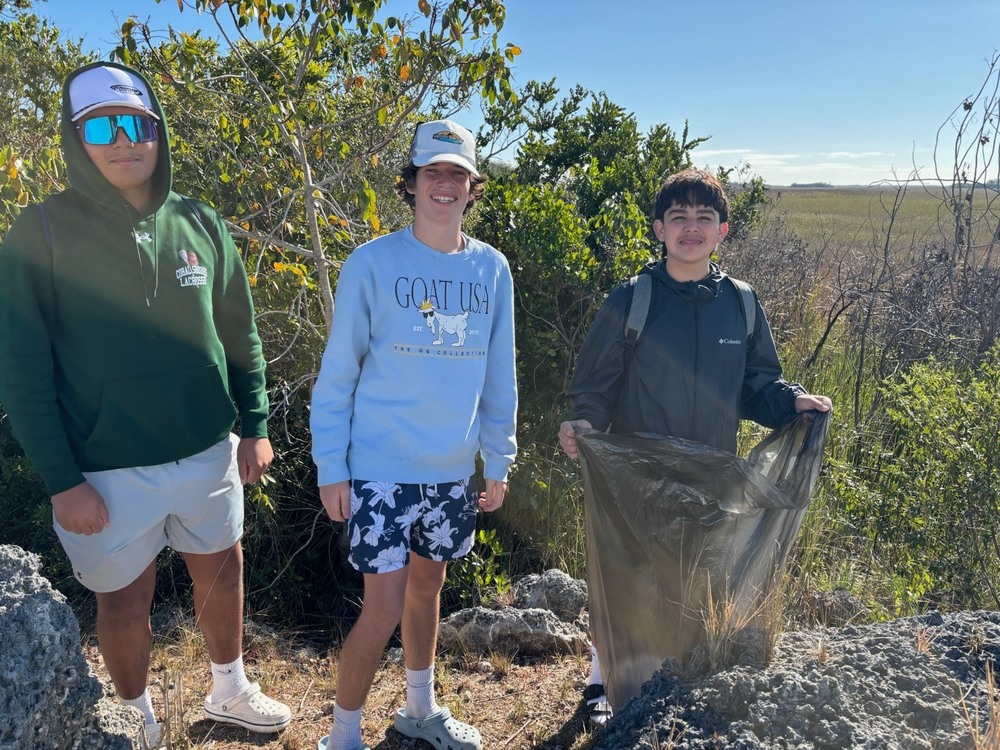 Students with bags to pick up trash