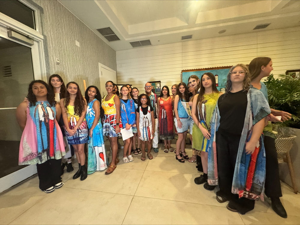 marathon fashion students posing with designs