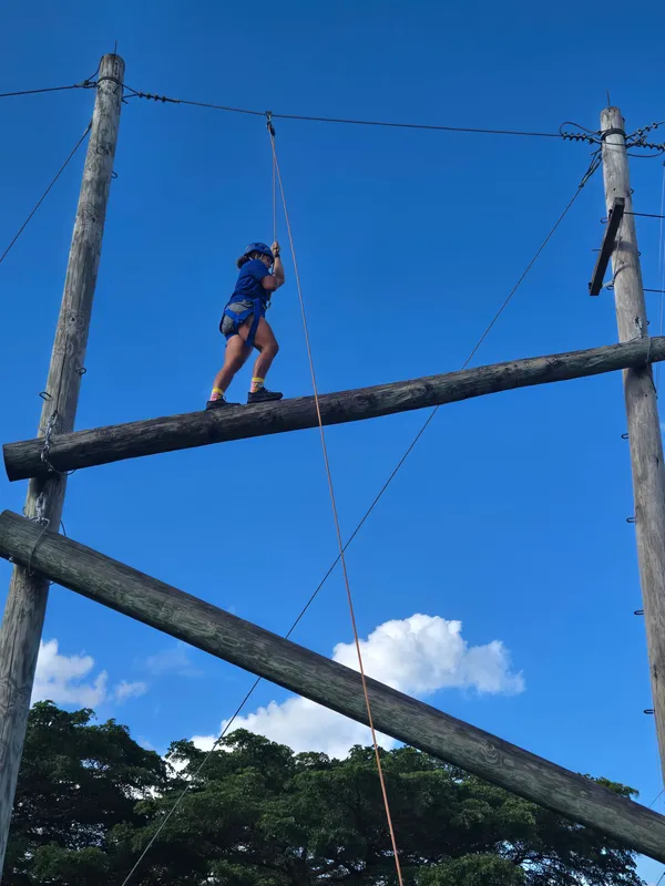 student balances across tightrope