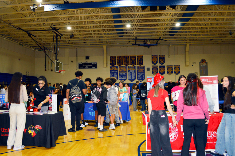 students visiting booths at college fair